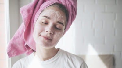 girl with towel turban and face mask